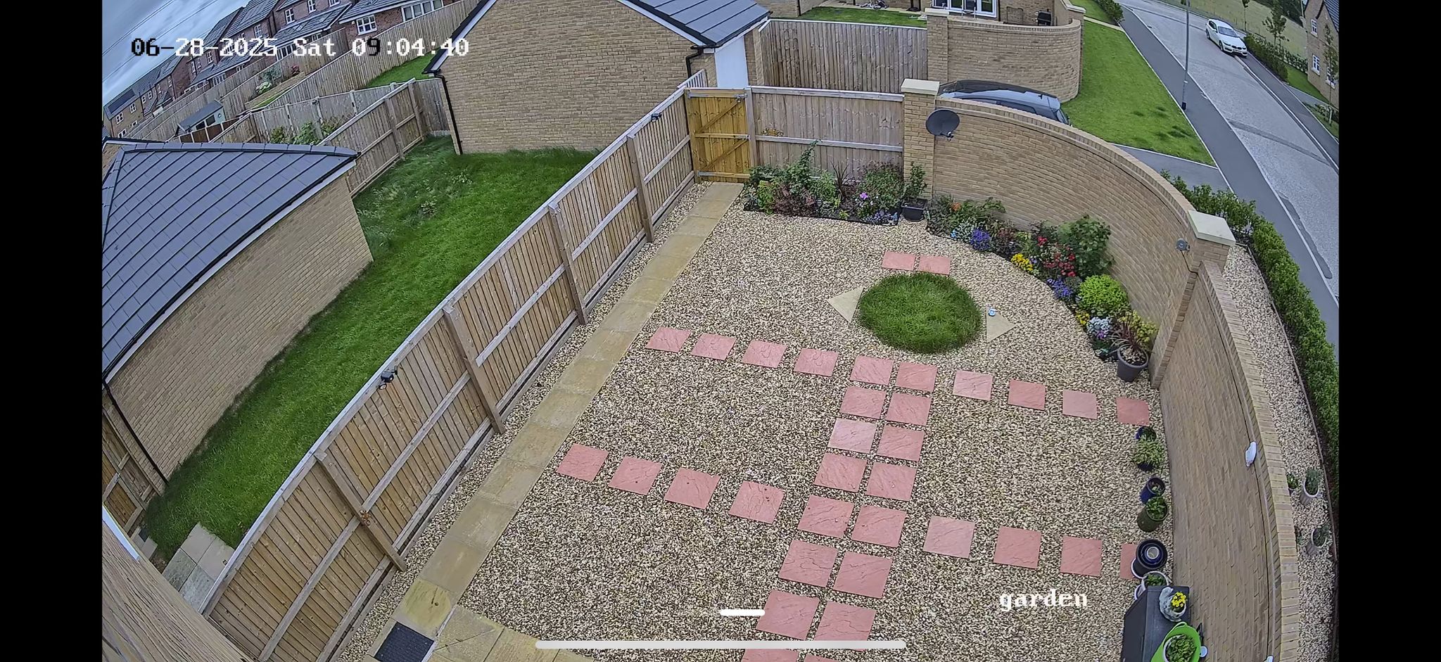 Daytime CCTV footage showing perfect back garden and gate view